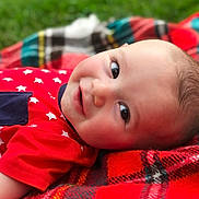 Jaylen is registered to the contest to win money with this photo: beauty, boy, cheek, child, close_up, eye, face, fun, grass, head, infant, lip, mouth, nose, organ, play, red, skin, smile, toddler