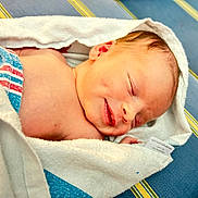 Kayden Jackowicz is registered to the contest to win money with this photo: baby, blue, closeup, cute, fabric, face, fresh, head, human, infant, newborn, peaceful, resting, skin, sleeping, smiling, soft, striped, towel, wrapped