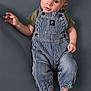 baby, barefoot, child, clothing, curious, cute, expression, green_shirt, head_tilt, indoor, infant, looking_up, lying_down, portrait, skin, small_feet, small_hands, soft_lighting, striped_overalls, young