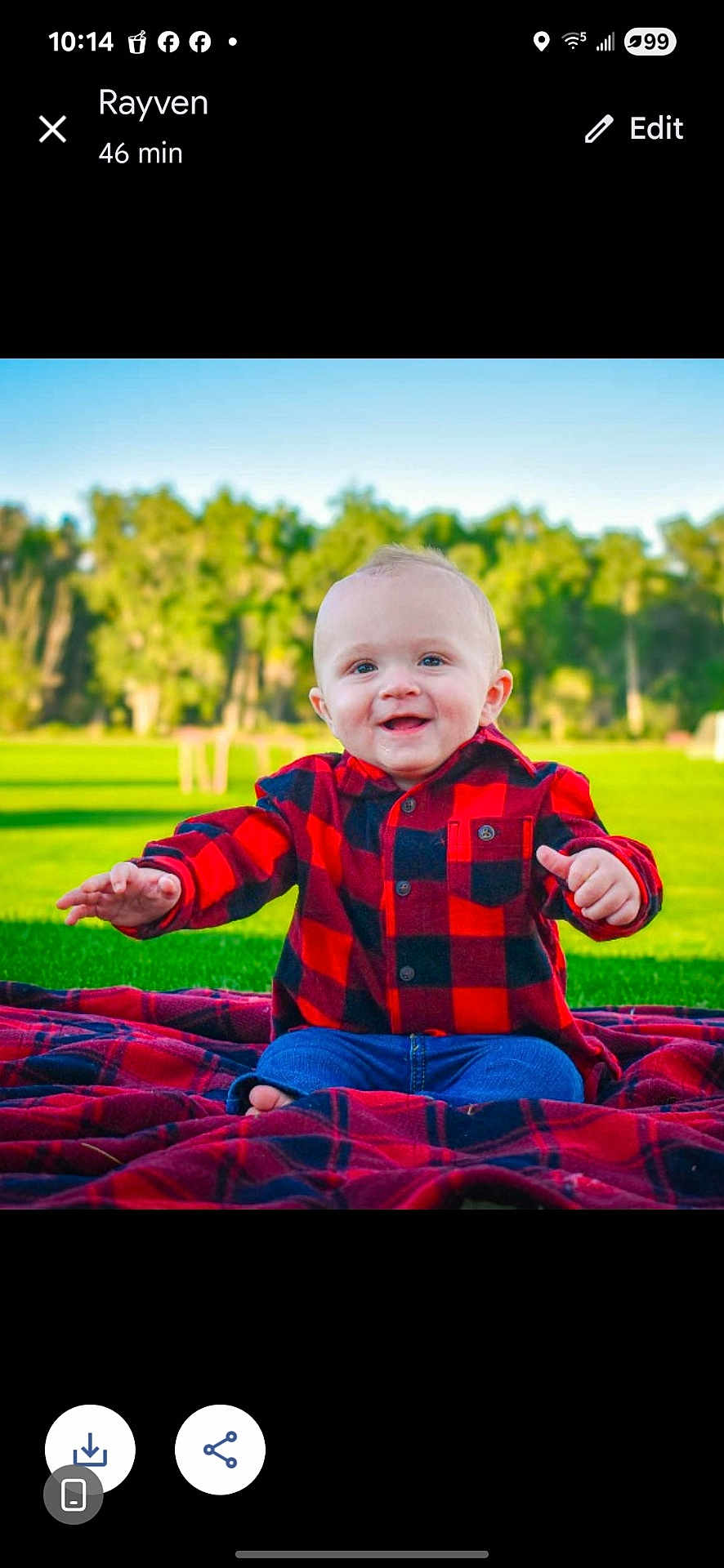 Christopher joined the competition — help win amazing prizes! baby, child, smiling, outdoor, grass, blanket, red_shirt, plaid, trees, nature, happy, sitting, portrait, cute, infant, blue_jeans, person, sunny, daylight, park