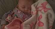 Keely joined the competition — help win amazing prizes! baby, blanket, bows, child, clothing, comfort, crib, cushion, face, head, indoors, infant, pacifier, peaceful, pink, resting, sleeping, soft, toddler, white