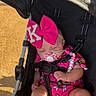 accessory, baby, beads, child, clothing, cute, footwear, infant, outdoor, pacifier, peaceful, pink_bow, portrait, relaxed, safety_harness, sleeping, stroller, summer, sunlight, toddler