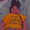 baby, pacifier, headband, bow, blanket, yellow_shirt, taco, shorts, clothing, infant, lying_down, indoors, cute, fringe, colorful, funny_text, child, person, comfort, relaxing