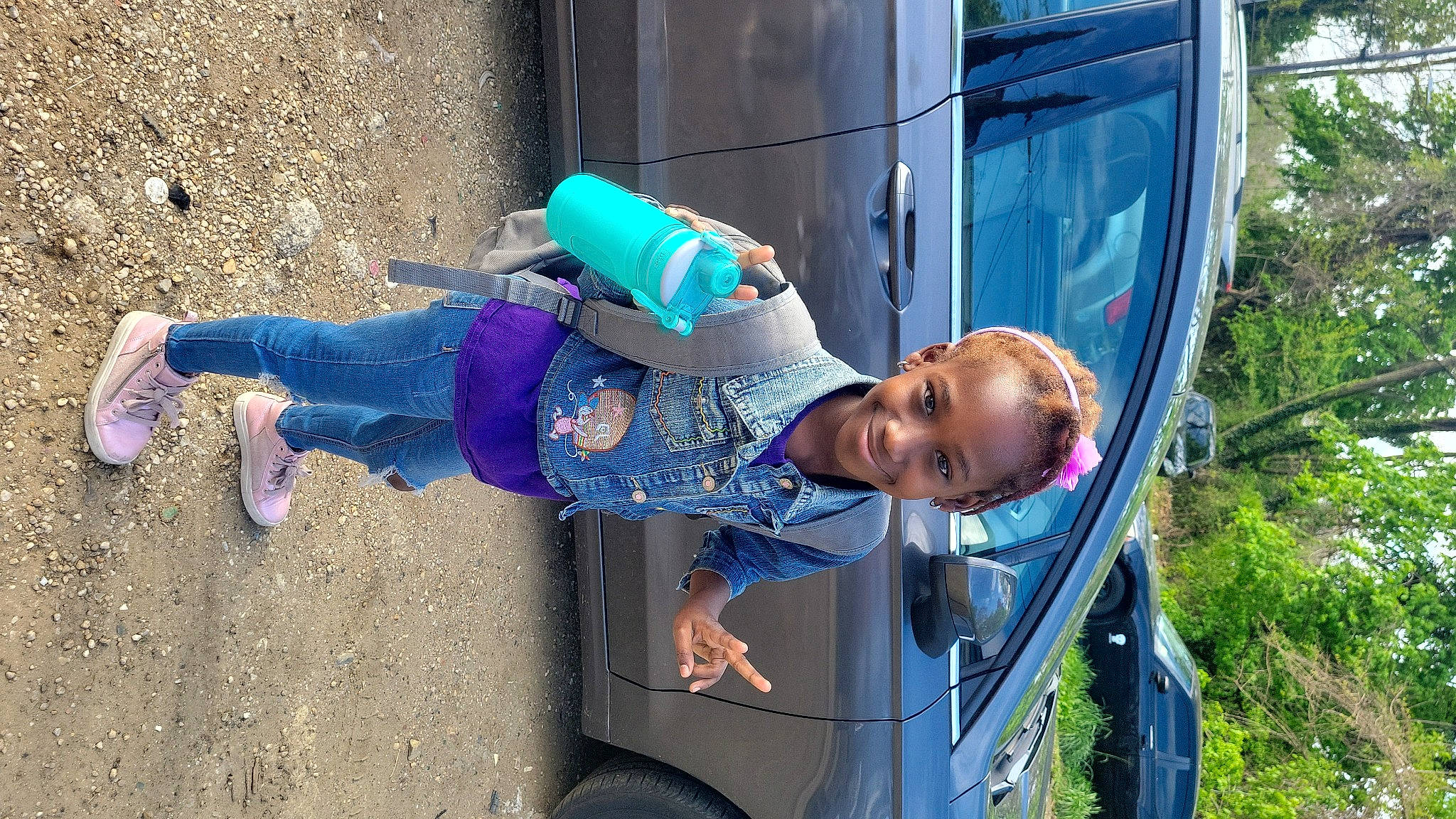 Theira is registered to the contest to win money with this photo: automotive_exterior, automotive_tire, car, child, electric_blue, fun, hat, joy, leisure, motor_vehicle, person, plant, recreation, street_fashion, t_shirt, tire, toddler, travel, tree, vehicle