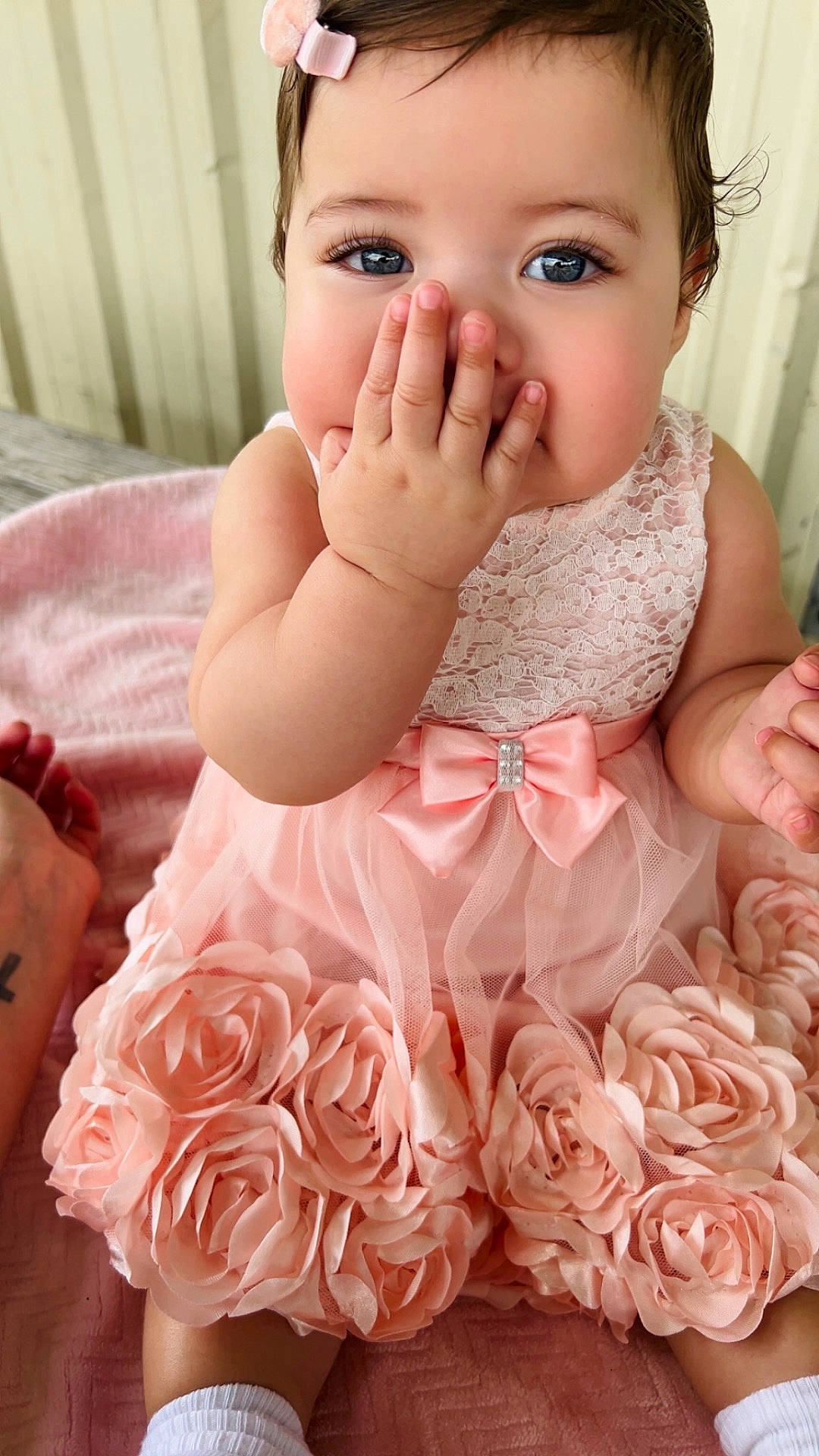 Everleigh is registered to the contest to win money with this photo: accessories, baby, bodypart, clothing, dahlia, dress, face, finger, flower, flowerarrangement, flowerbouquet, hand, head, person, petal, photography, plant, portrait, rose, sitting
