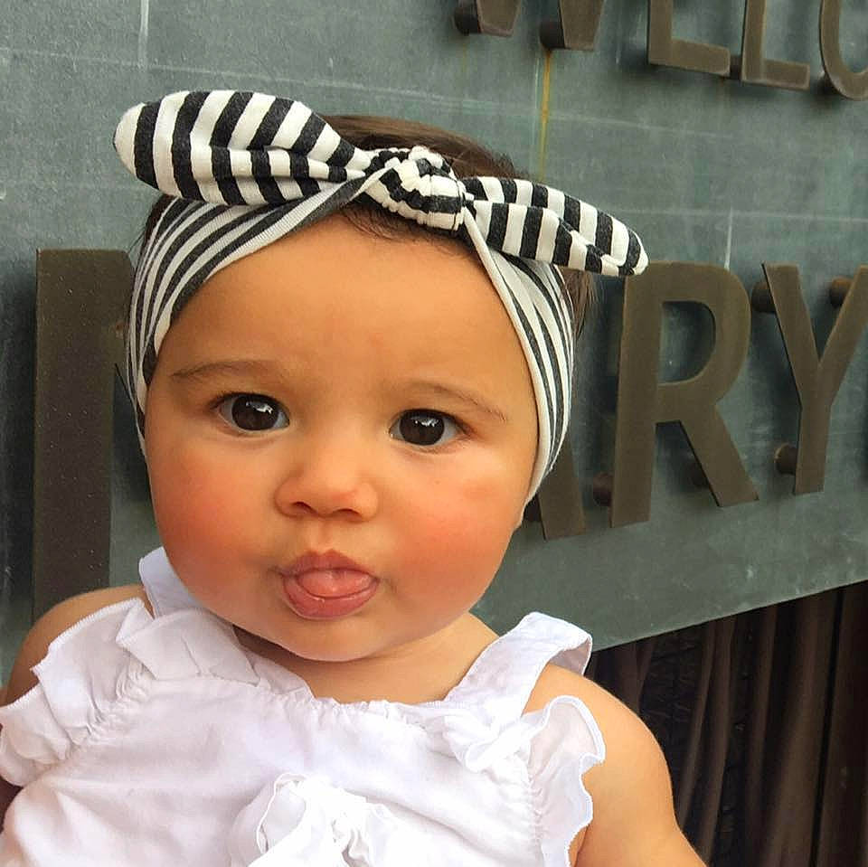 Olive Rose is registered to the contest to win money with this photo: baby, baby_toddler_clothing, bonnet, cap, child, clothing, cool, costume_accessory, fashion_accessory, hair_accessory, hat, head, headband, headgear, headpiece, person, toddler