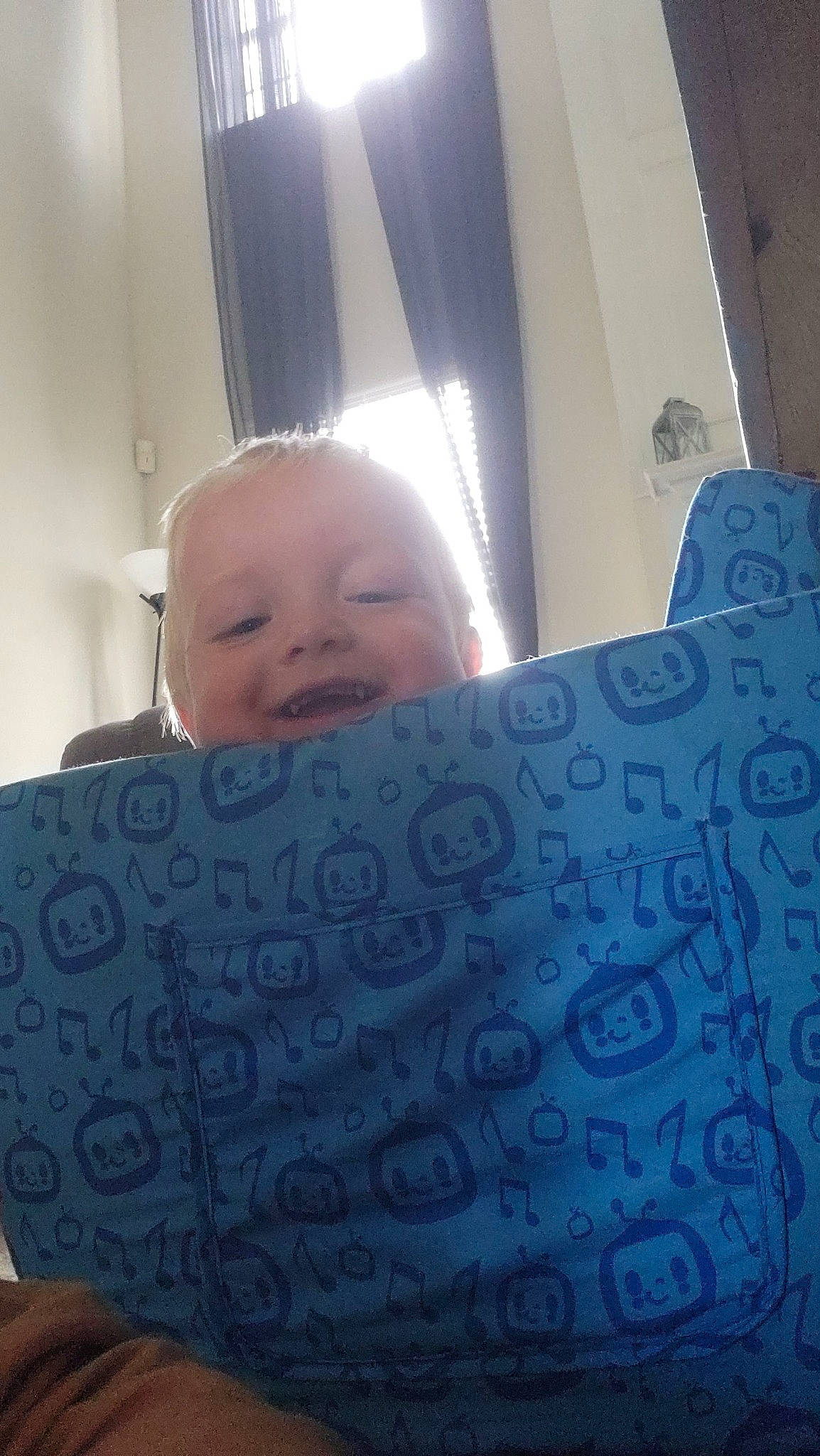 Parker joined the competition — help win amazing prizes! baby, baby_toddler_clothing, child, comfort, electric_blue, finger, font, lighting_accessory, linens, nail, nose, office_equipment, pattern, person, room, sitting, smile, textile, thumb, toddler