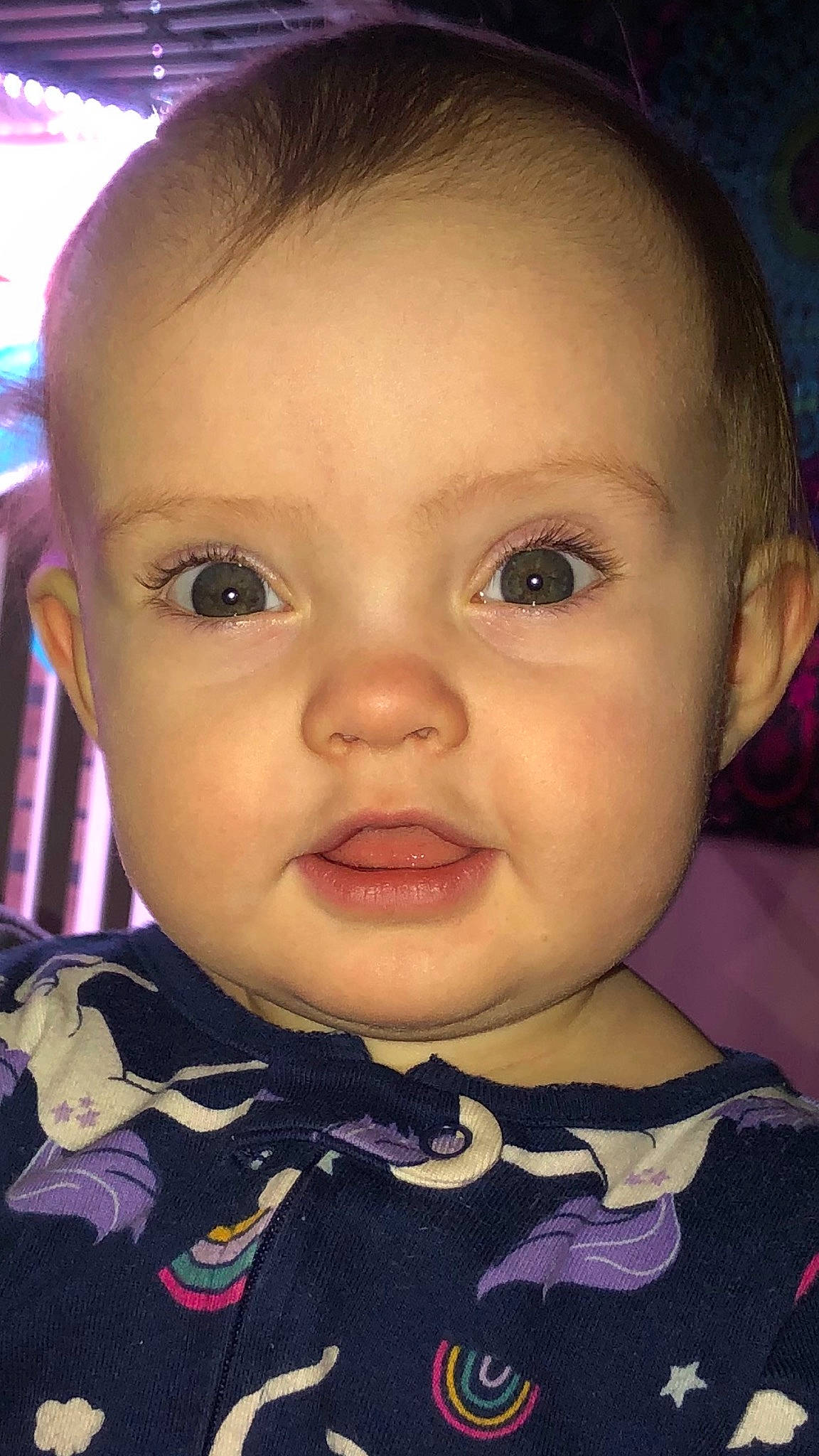 Otis is registered to the contest to win money with this photo: baby, baby_toddler_clothing, black_hair, cheek, child, chin, ear, eyebrow, eyelash, facial_expression, forehead, hairstyle, iris, lip, mouth, nose, person, pink, skin, smile