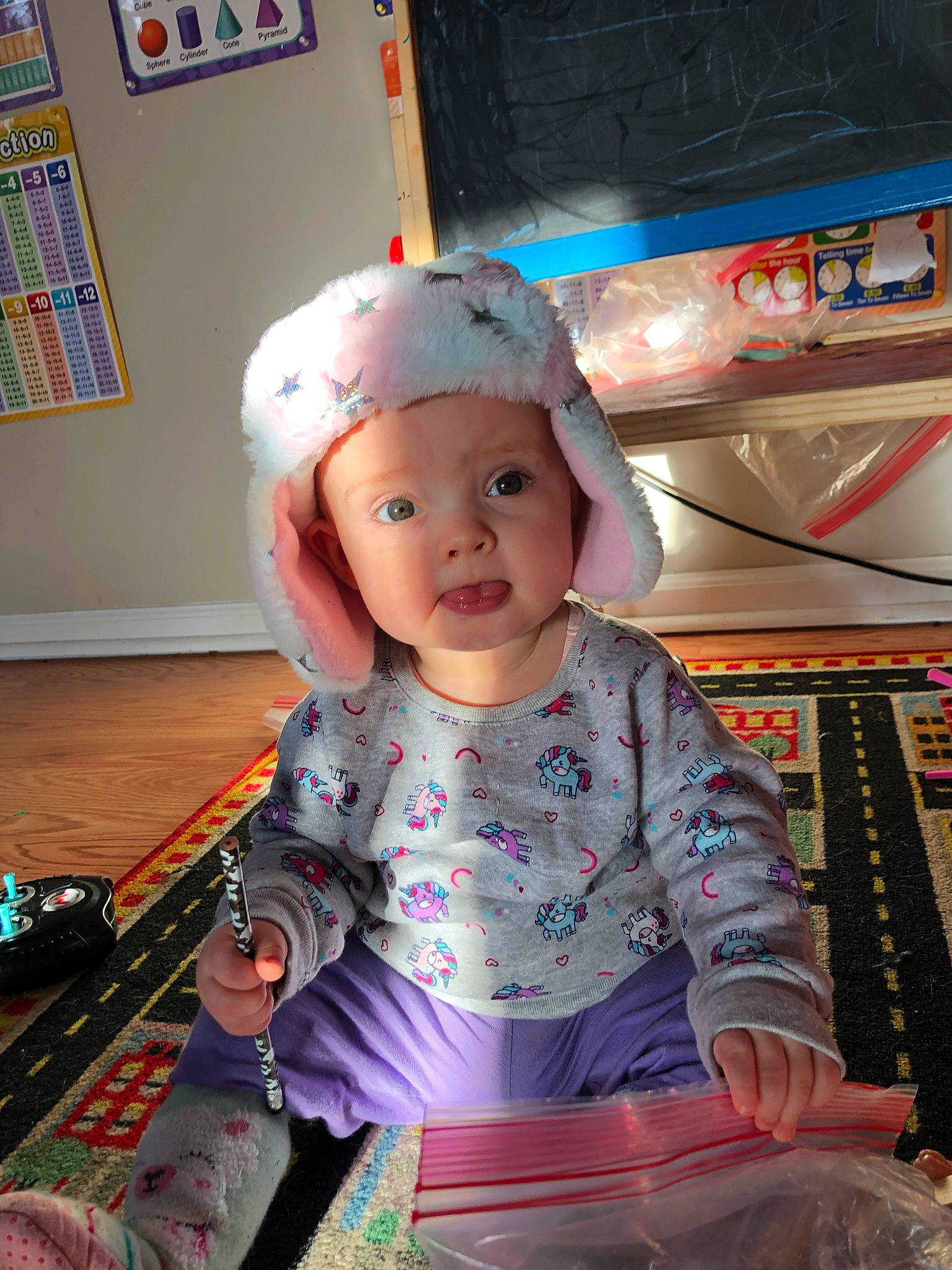 Otis joined the competition — help win amazing prizes! baby, baby_toddler_clothing, baseball_cap, blue, bookcase, cap, child, cool, eye, fashion_accessory, fun, happy, head, headwear, magenta, person, pink, room, shelf, sleeve