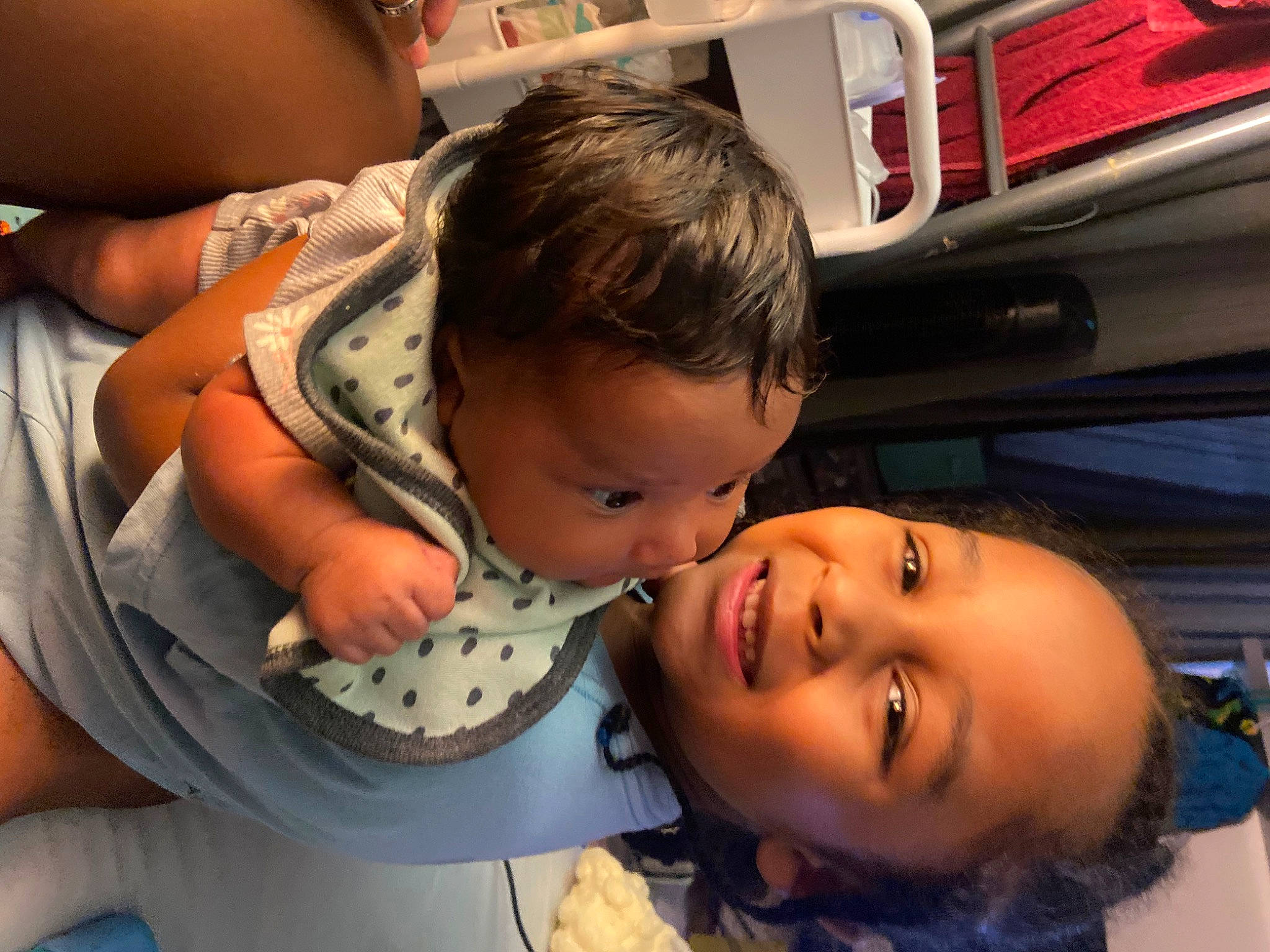 Kendal is registered to the contest to win money with this photo: baby, baby_toddler_clothing, cheek, child, comfort, eyelash, fun, gesture, happy, joy, mouth, nose, person, room, sitting, skin, smile, toddler, vacation