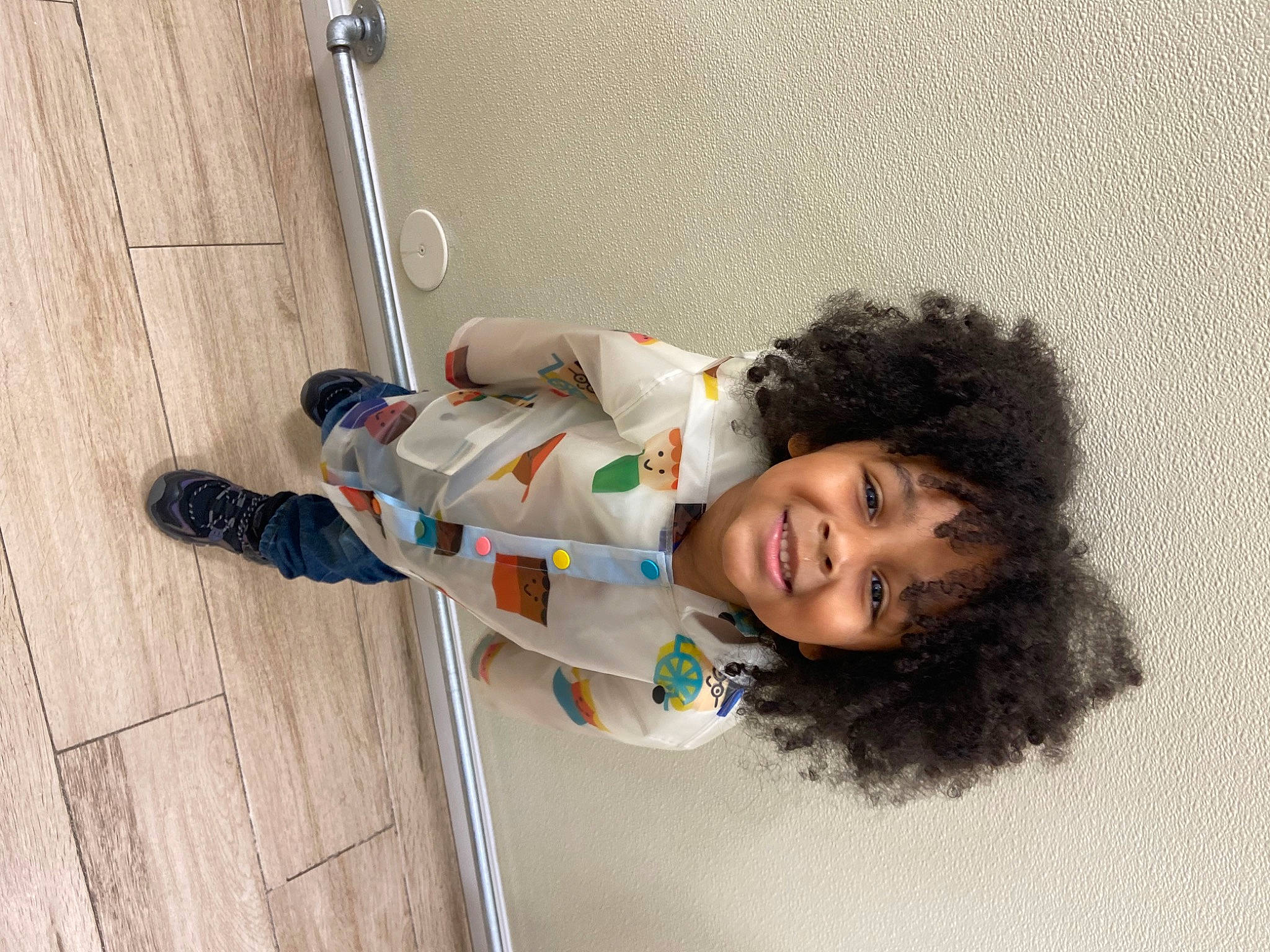 Kendal is registered to the contest to win money with this photo: baby_toddler_clothing, child, concrete, floor, flooring, fun, happy, hardwood, joy, leisure, outdoor_shoe, person, sitting, smile, toddler, wood, wood_flooring