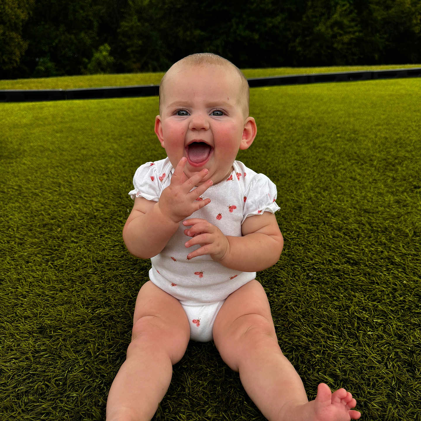 Vivian joined the competition — help win amazing prizes! baby, infant, grass, outdoor, smiling, happy, child, nature, greenery, sitting, cute, playful, trees, daylight, one_person, skin, barefoot, short_sleeves, expression, young