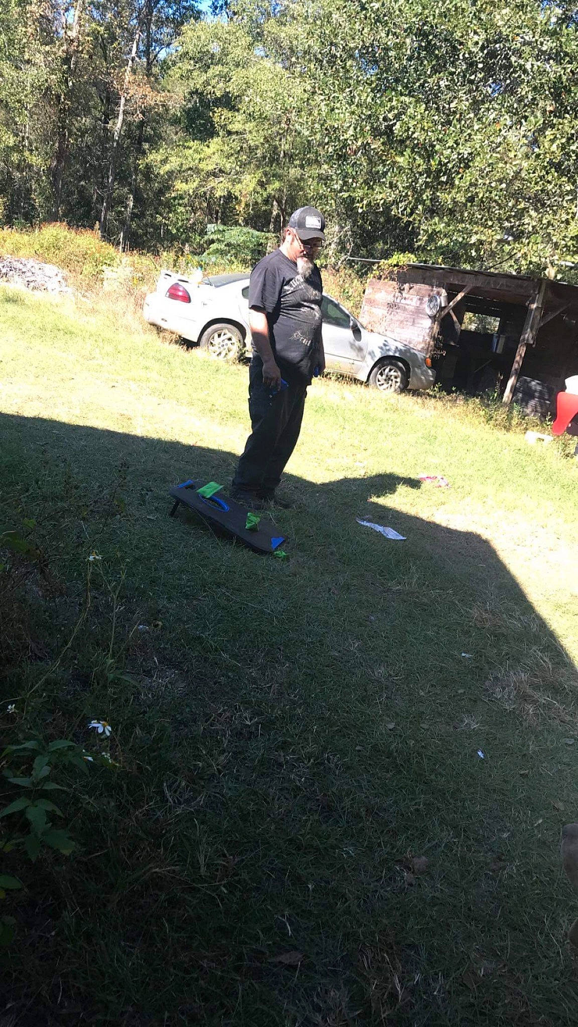 Hunter King is registered to the contest to win money with this photo: asphalt, automotive_exterior, car, grass, grass_family, grassland, land_vehicle, landscape, lawn, leisure, person, plant, recreation, road_surface, shrub, tints_and_shades, tire, tree, vehicle, vehicle_door