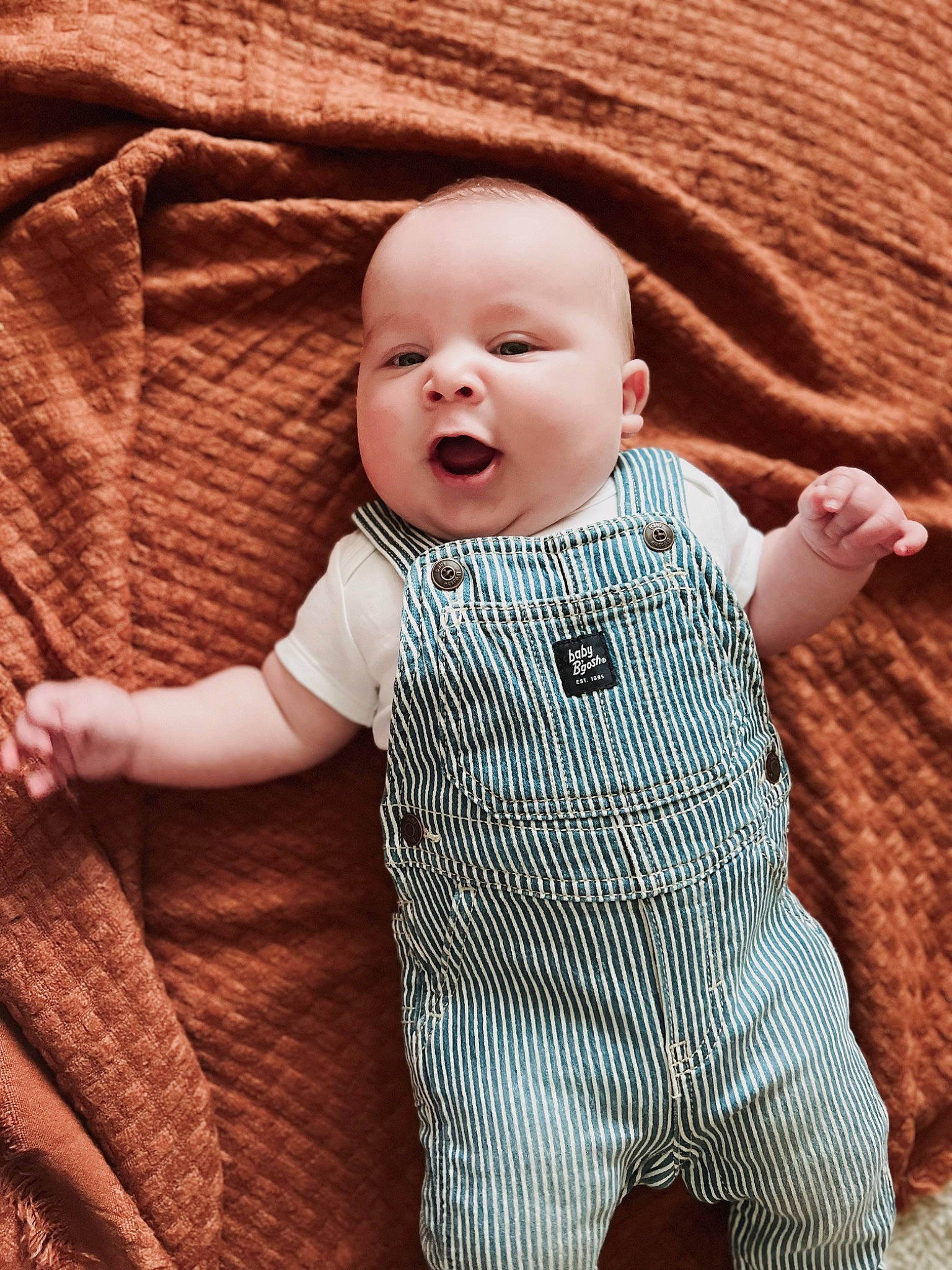 Waylen is registered to the contest to win money with this photo: baby, baby_toddler_clothing, cheek, child, collar, comfort, face, facial_expression, finger, gesture, hand, happy, human, outerwear, person, skin, sleeve, standing, textile, toddler