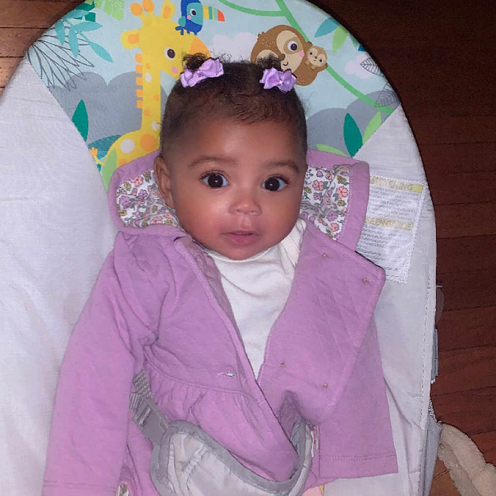 Kianna is registered to the contest to win money with this photo: accessories, baby, bed, bonnet, clothing, cradle, crib, cushion, dress, face, fashion, formalwear, furniture, hat, head, homedecor, infantbed, person, photography, portrait