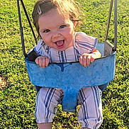 Rylee joined the competition — help win amazing prizes! toddler, child, swing, outdoor, grass, sunlight, happy, smiling, clothing, hair_clip, playground, play, fun, baby, person, nature, daylight, joy, seat, blue_swing