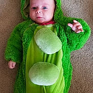 Sophia is registered to the contest to win money with this photo: baby, child, child_model, costume, fictional_character, green, leaf, outerwear, plant, smile, toddler