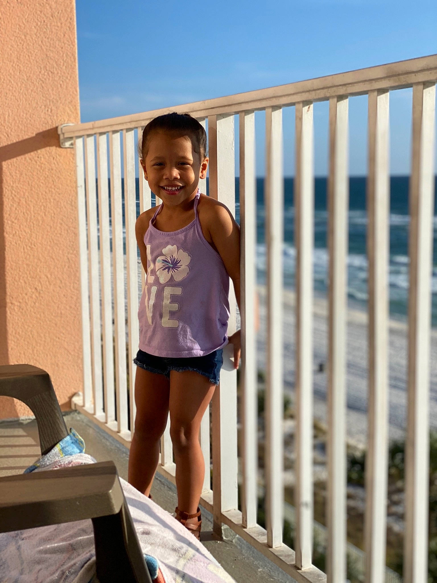 Carma is registered to the contest to win money with this photo: balcony, child, joy, leg, leisure, person, product, smile, summer, toddler, vacation