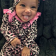 Acelynn joined the competition — help win amazing prizes! baby, child, smiling, tongue_out, leopard_print, headband, pink, black, onesie, socks, sitting, fluffy_blanket, cute, playful, infant, portrait, happy, indoors, person, apparel