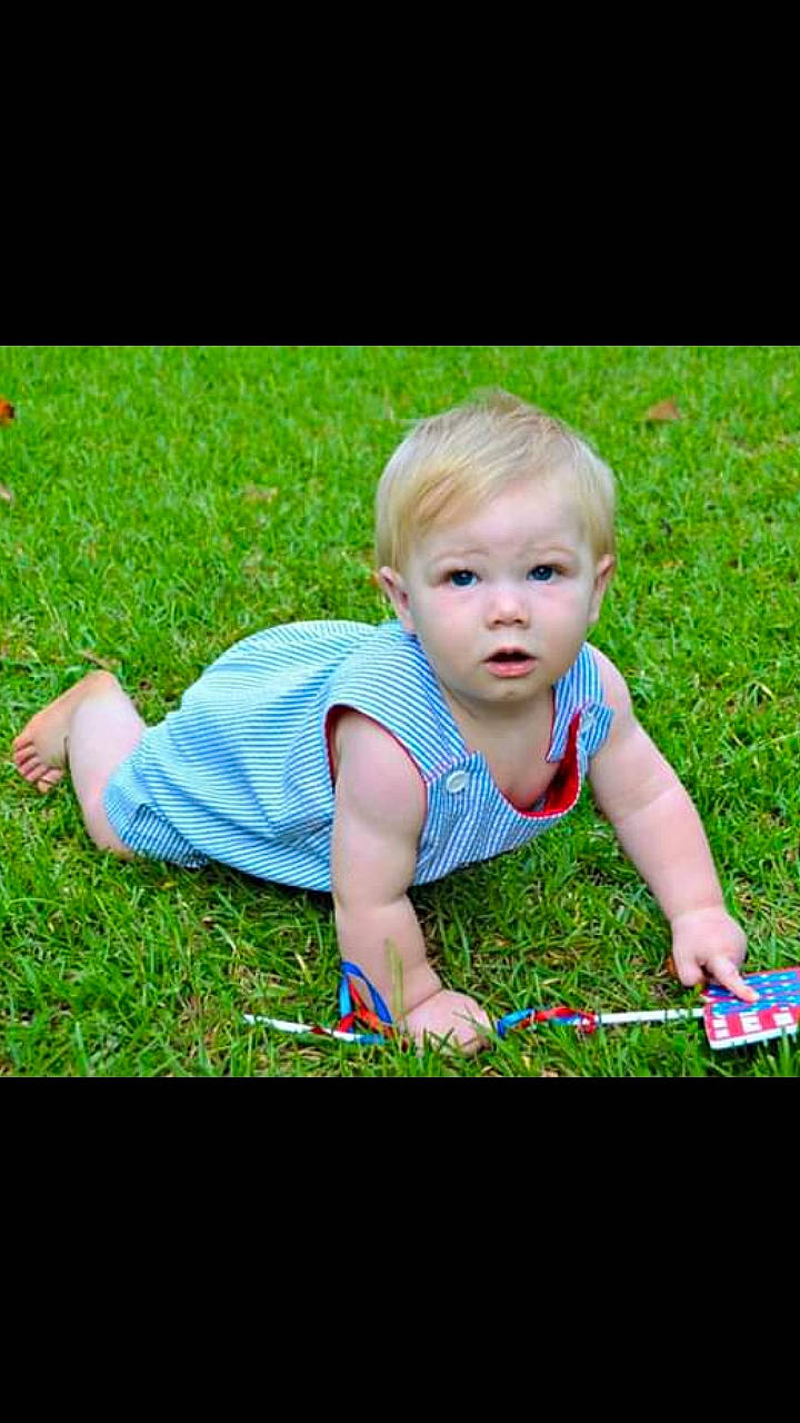 Spencer joined the competition — help win amazing prizes! baby, child, crawling, fun, grass, grass_family, lawn, meadow, person, photography, plant, play, sitting, smile, summer, toddler