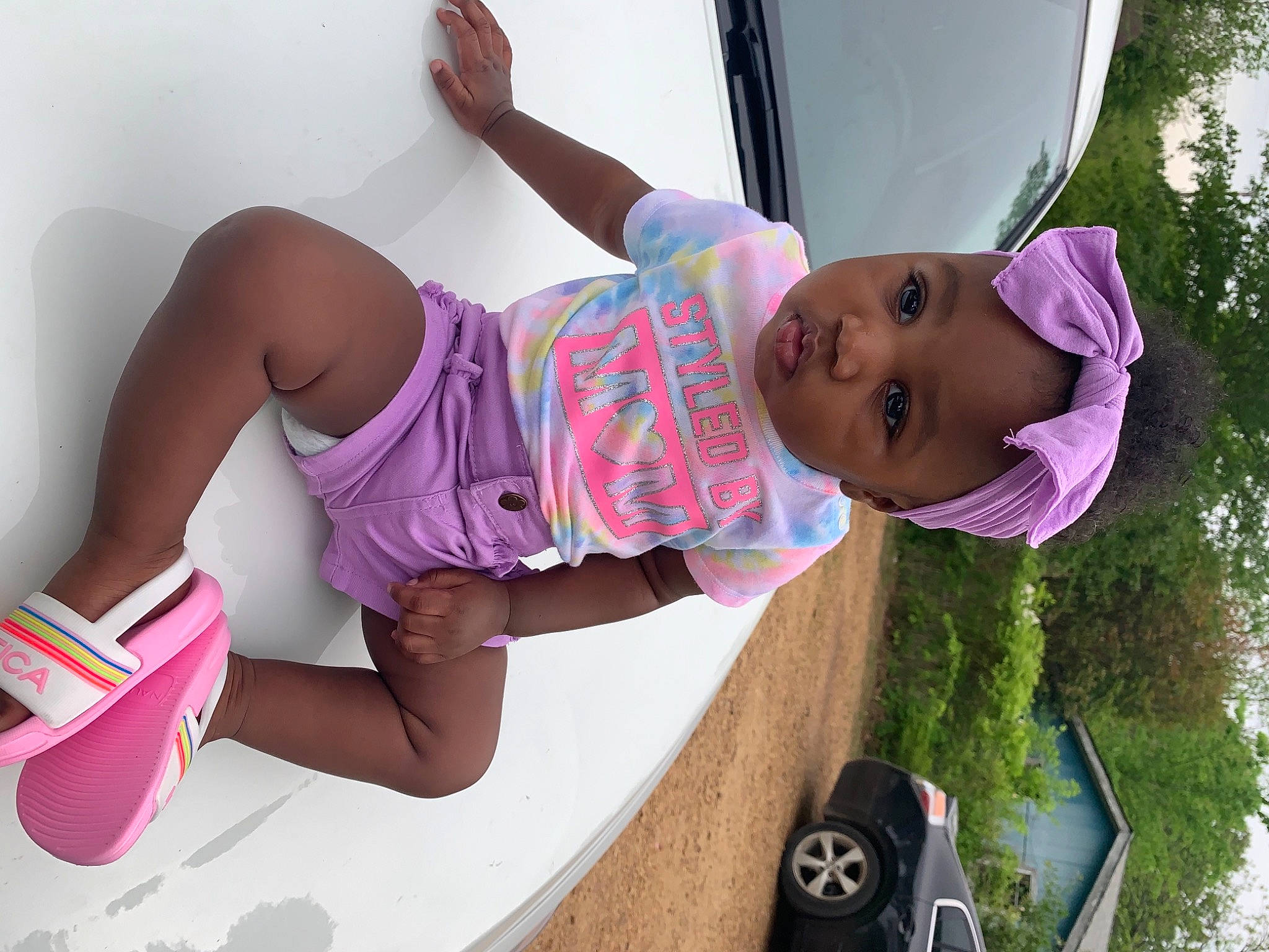 Jalaya is registered to the contest to win money with this photo: baby, baby_toddler_clothing, child, facial_expression, fun, happy, hat, headwear, human_leg, knee, leisure, magenta, mouth, person, pink, plant, purple, shorts, t_shirt, thigh