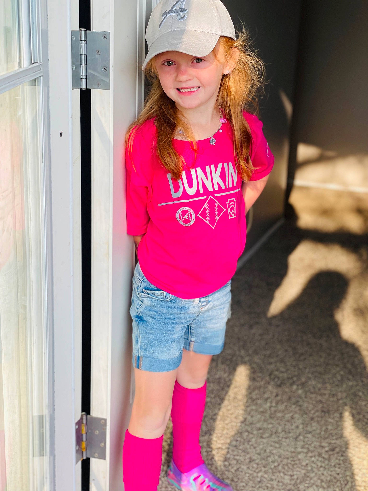 Emma joined the competition — help win amazing prizes! baseball_cap, cap, clothing, cool, denim, face, fashion, happy, hat, headwear, joy, knee, leg, person, pink, shorts, shoulder, sleeve, smile, standing