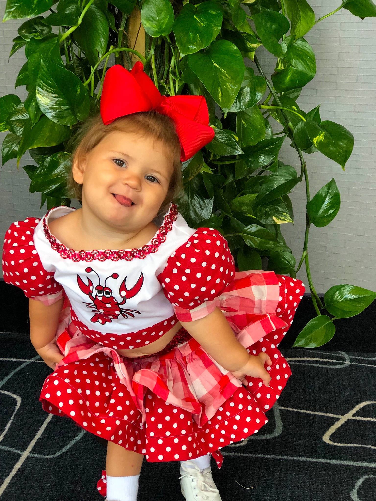 Athena joined the competition — help win amazing prizes! baby_products, baby_toddler_clothing, child, child_model, clothing, costume, design, dress, flower, joy, pattern, person, plant, polka_dot, red, smile, toddler