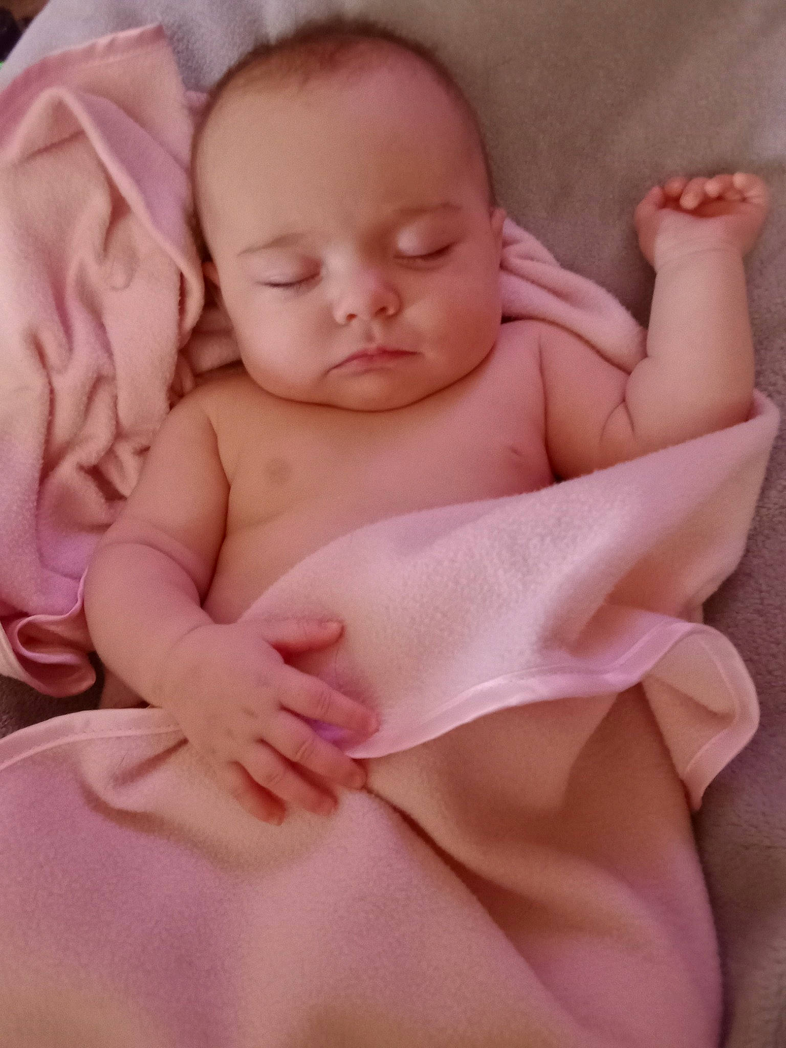 Lucinda is registered to the contest to win money with this photo: abdomen, arm, baby, baby_products, baby_sleeping, baby_toddler_clothing, cheek, chest, comfort, ear, finger, hand, happy, linens, person, pink, sitting, skin, stomach, thumb