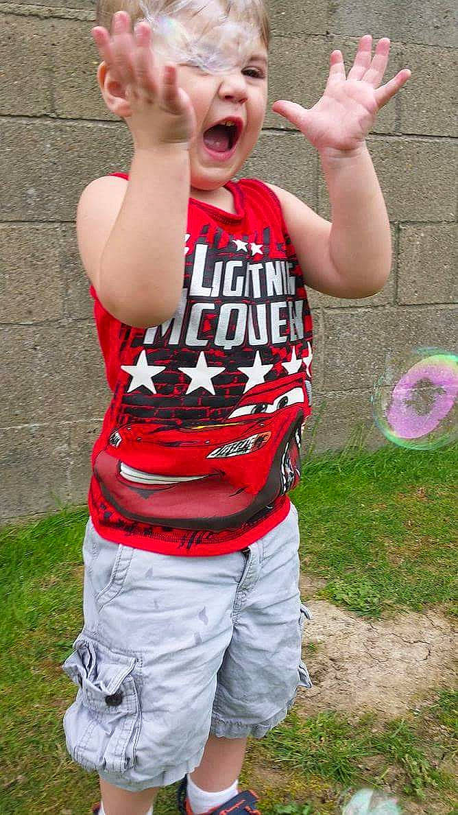 Ericson is registered to the contest to win money with this photo: arm, child, cool, grass, person, play, shorts, summer, t_shirt, toddler