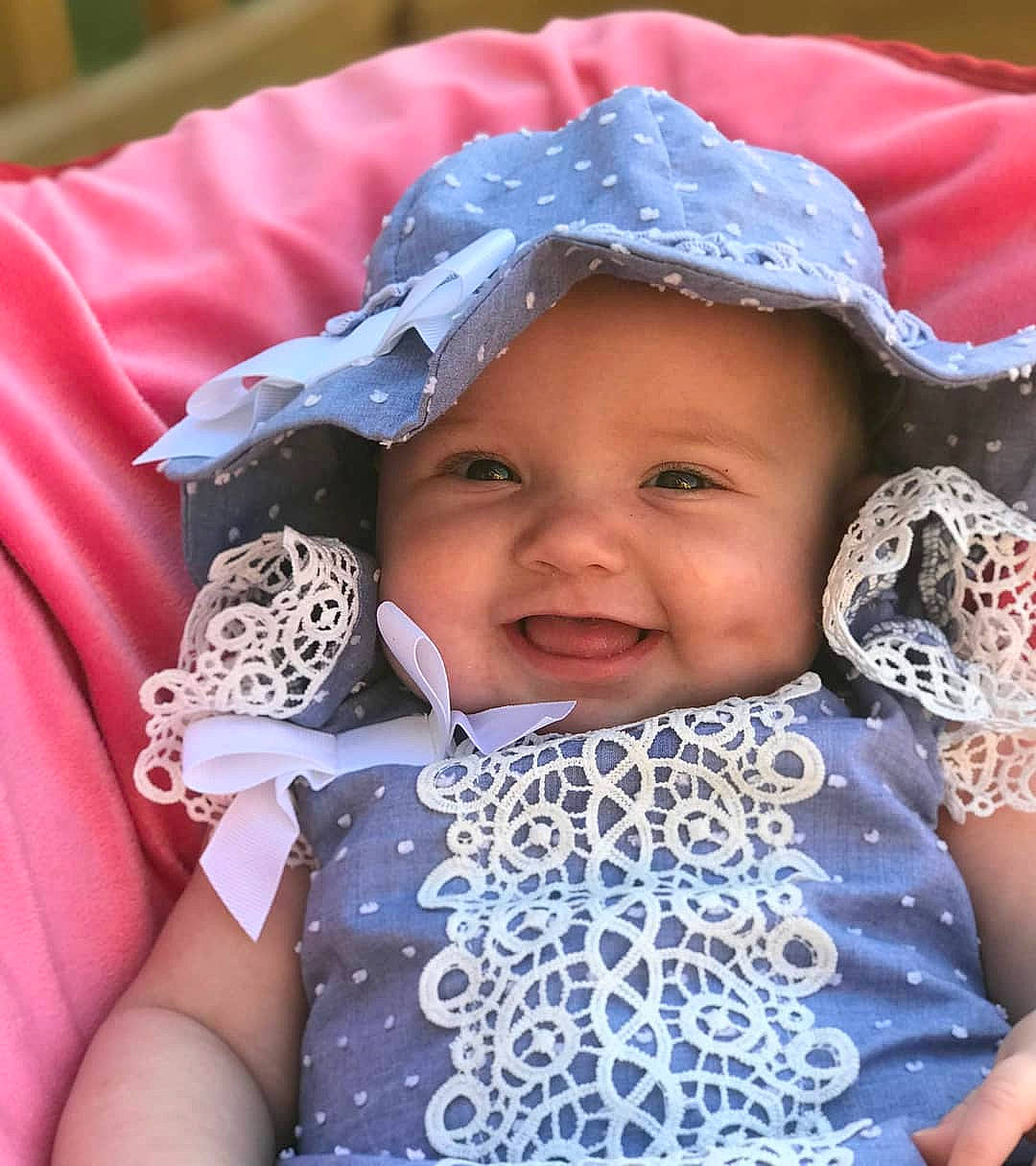 Scarlett joined the competition — help win amazing prizes! baby, baby_products, baby_toddler_clothing, bonnet, child, headgear, joy, pattern, person, product, textile, toddler