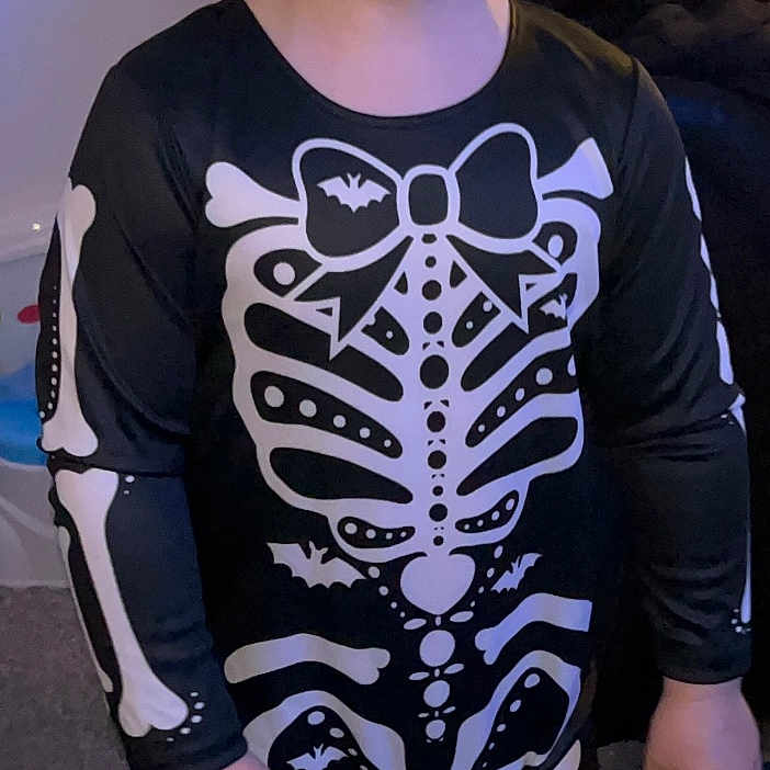 Rory joined the competition — help win amazing prizes! barefoot, black, carpet, child, childhood, clothing, costume, cute, face, fun, halloween, happy, hat, indoor, person, skeleton, skeleton_costume, smile, toy, white