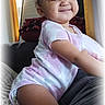 Za'Riyah joined the competition — help win amazing prizes! baby, child, smile, indoor, onesie, curtains, blanket, couch, window, light, face, person, happy, toddler, hair, cheeky, clothing, furniture, home, portrait
