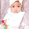 Za'Riyah joined the competition — help win amazing prizes! baby, child, infant, headband, bow, toy, colorful, blanket, soft, cute, clothing, sitting, expression, comfort, indoor, person, young, striped_pants, pink, white