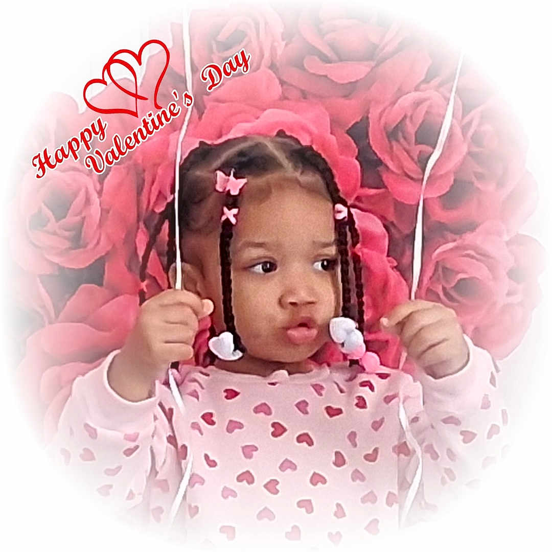 Za'Riyah is registered to the contest to win money with this photo: child, girl, braids, pink_clothing, heart_pattern, valentines_day, flowers, roses, background, holding_strings, cute, portrait, holiday, celebration, hair_clips, young_child, pink, love, festive, smiling_face