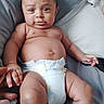 Ethan is registered to the contest to win money with this photo: baby, diaper, infant, hand, bed, bedding, sheet, skin, person, cute, expression, lying_down, fingers, child, newborn, indoors, soft, comfort, human, face