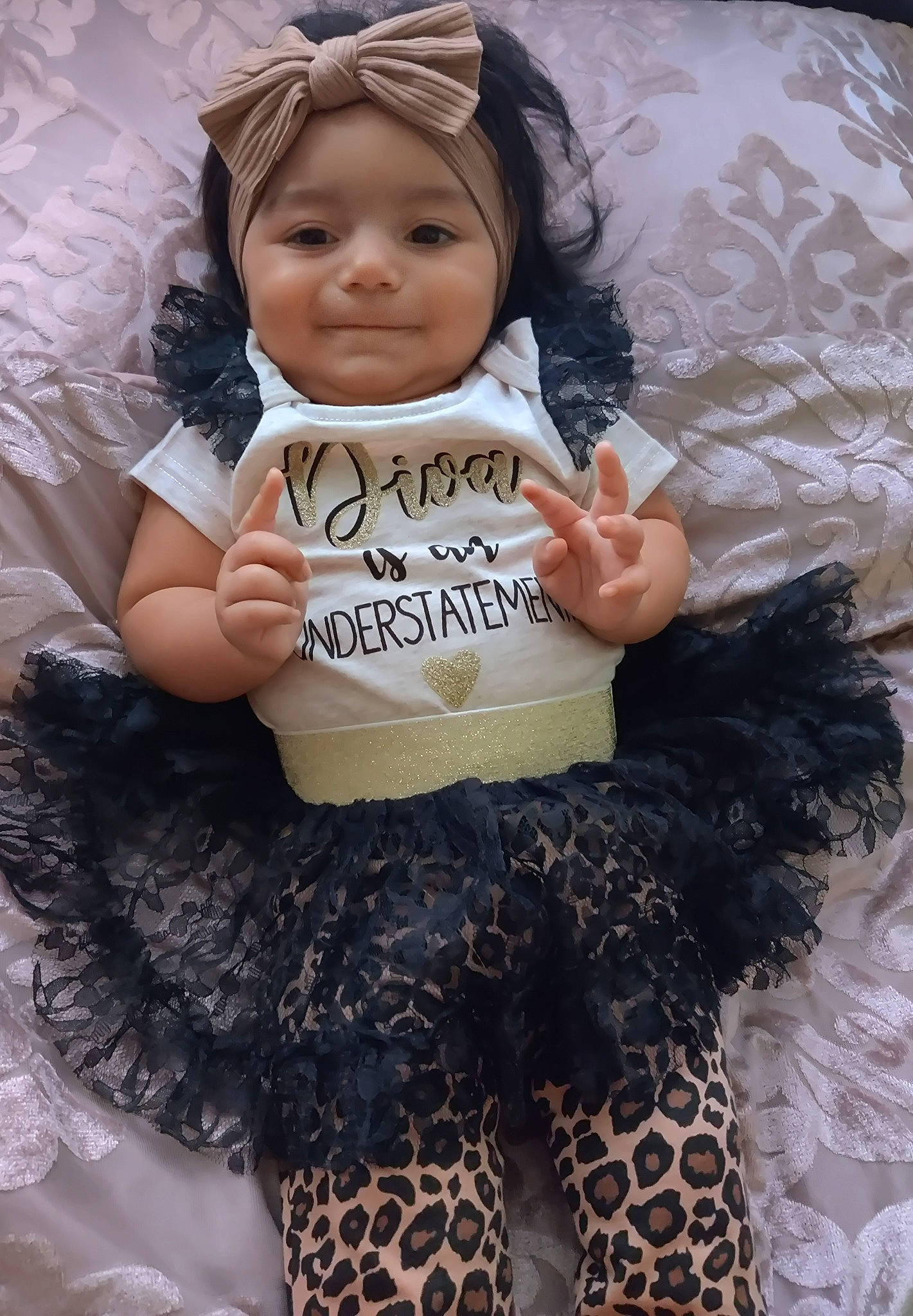 Marielys is registered to the contest to win money with this photo: abdomen, arm, baby, baby_toddler_clothing, beauty, black, cool, eye, happy, head, headgear, headwear, joy, person, pink, skin, sleeve, smile, textile, thigh