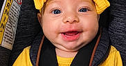 Riley joined the competition — help win amazing prizes! adorable, baby, blue_eyes, bright_colors, car_seat, child, child_safety, closeup, cute, face, happy, headband, infancy, infant, portrait, safety, seatbelt, smile, yellow_clothing, young_child