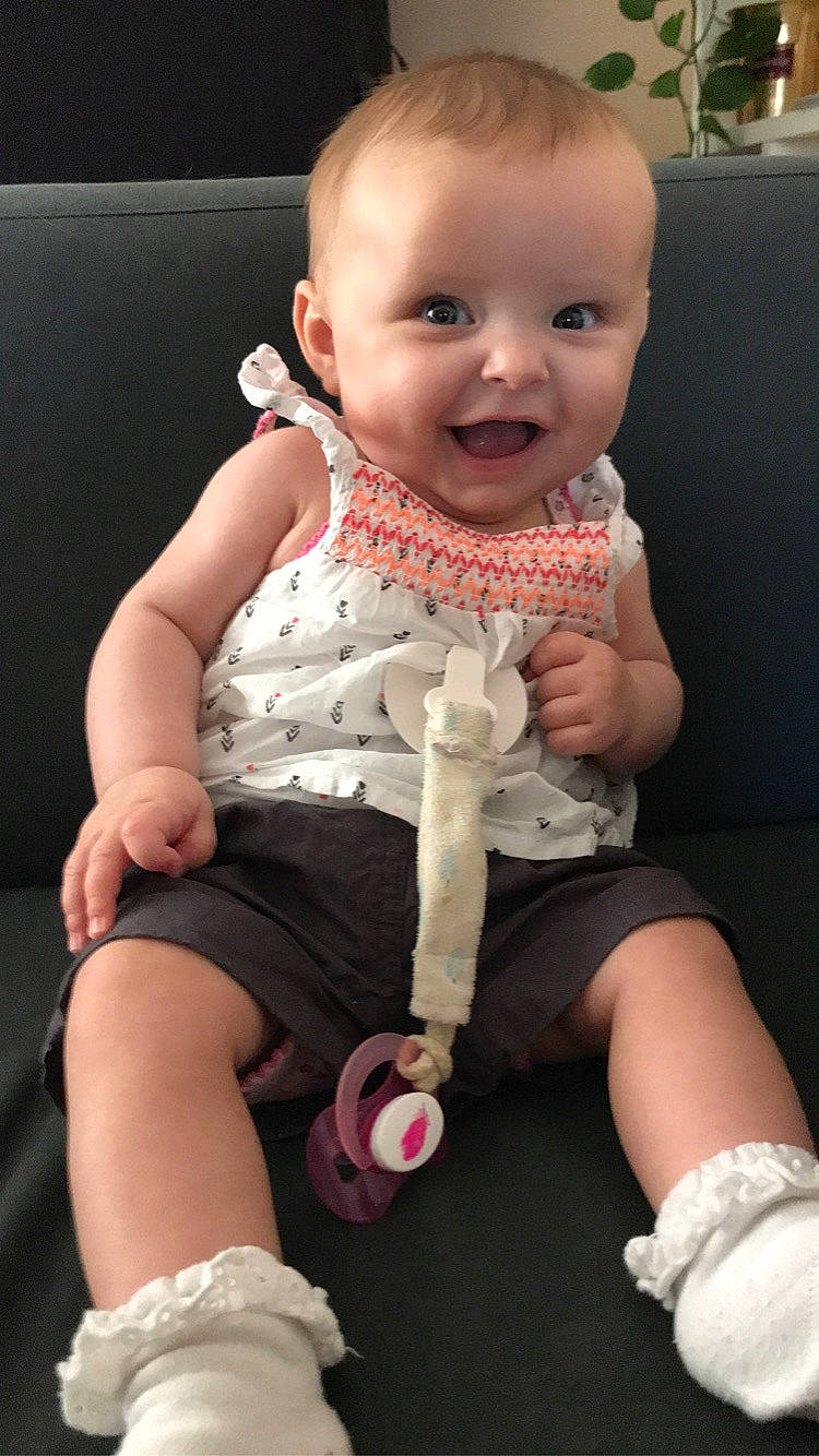 Lyanna participe au concours pour gagner de l'argent avec cette photo : baby, baby_products, baby_toddler_clothing, cheek, child, joy, leg, person, pink, play, product, sitting, skin, sleeve, toddler