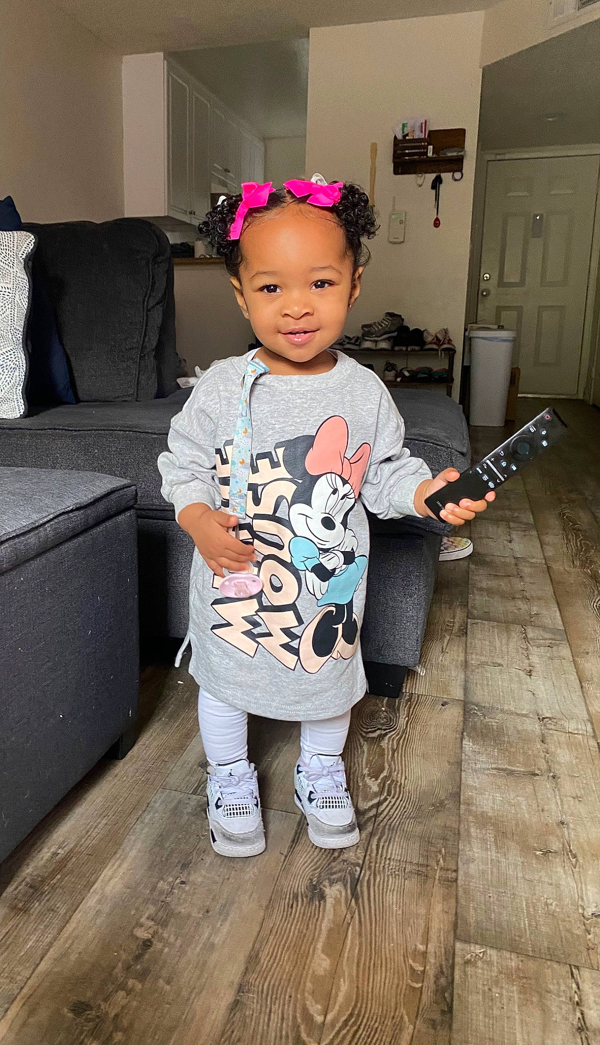 Mykenzie is registered to the contest to win money with this photo: baby_toddler_clothing, child, cool, couch, door, eye, floor, flooring, hairstyle, happy, hardwood, head, joy, person, pillow, sleeve, smile, sock, standing, t_shirt