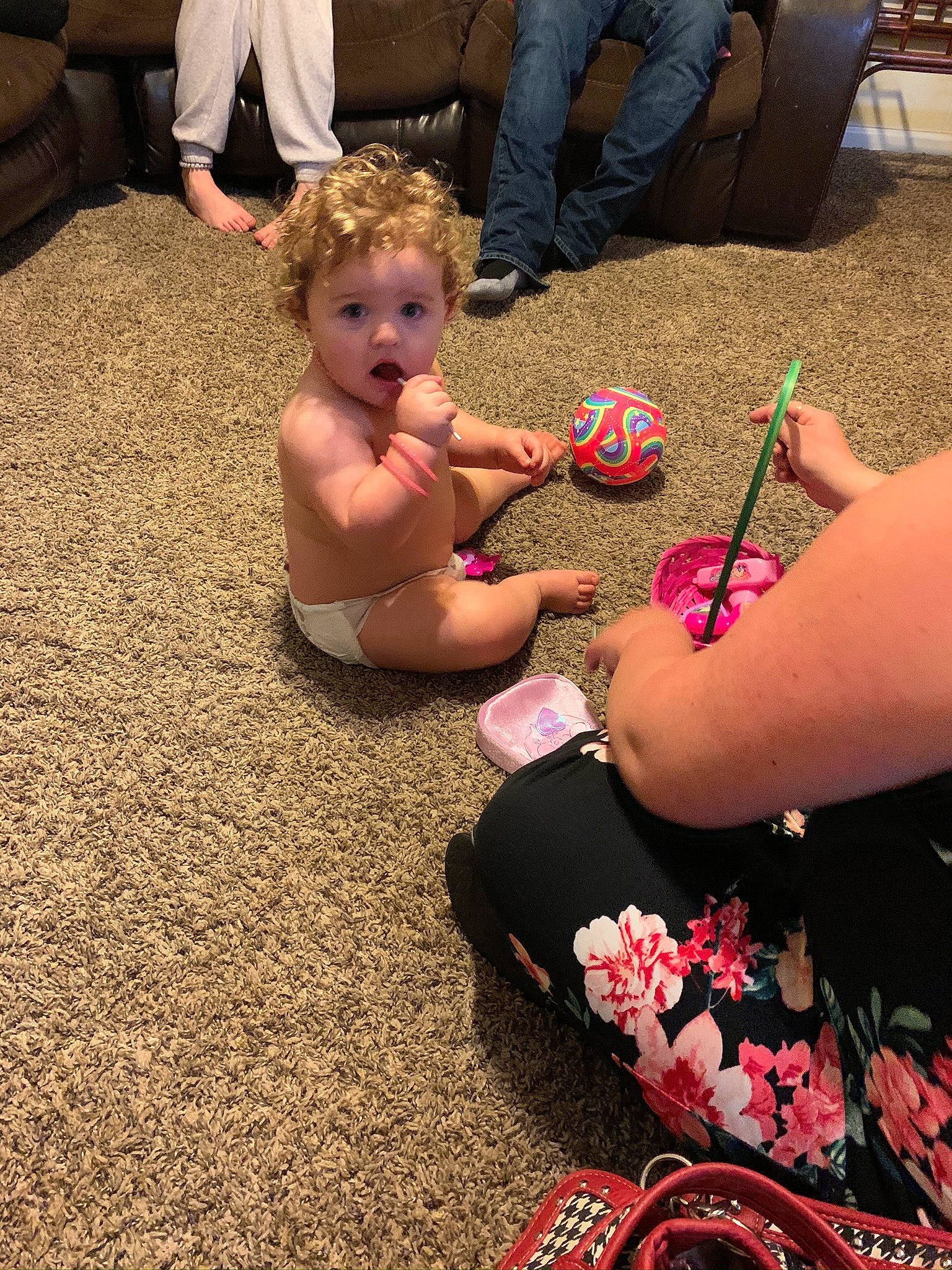 Marilyn is registered to the contest to win money with this photo: child, finger, flooring, foot, fun, leg, person, play, sitting, surprise, toddler