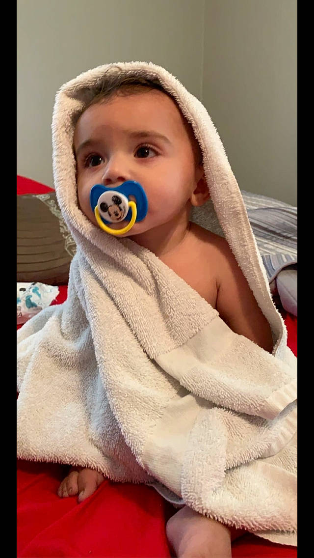 Tavon joined the competition — help win amazing prizes! baby, blanket, cheek, child, eye, face, facial_expression, happy, head, human, linens, mouth, nose, person, photo_caption, photography, skin, smile, textile, toddler