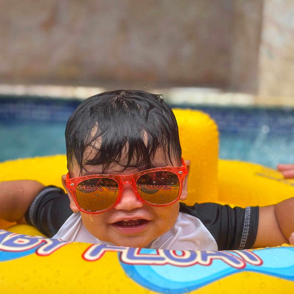 Edriel joined the competition — help win amazing prizes! child, floating, fun, happy, kid, leisure, outdoor, play, pool, relax, smiling, summer, sunglasses, sunny, swimming, toy, vacation, water, wet_hair, yellow_float