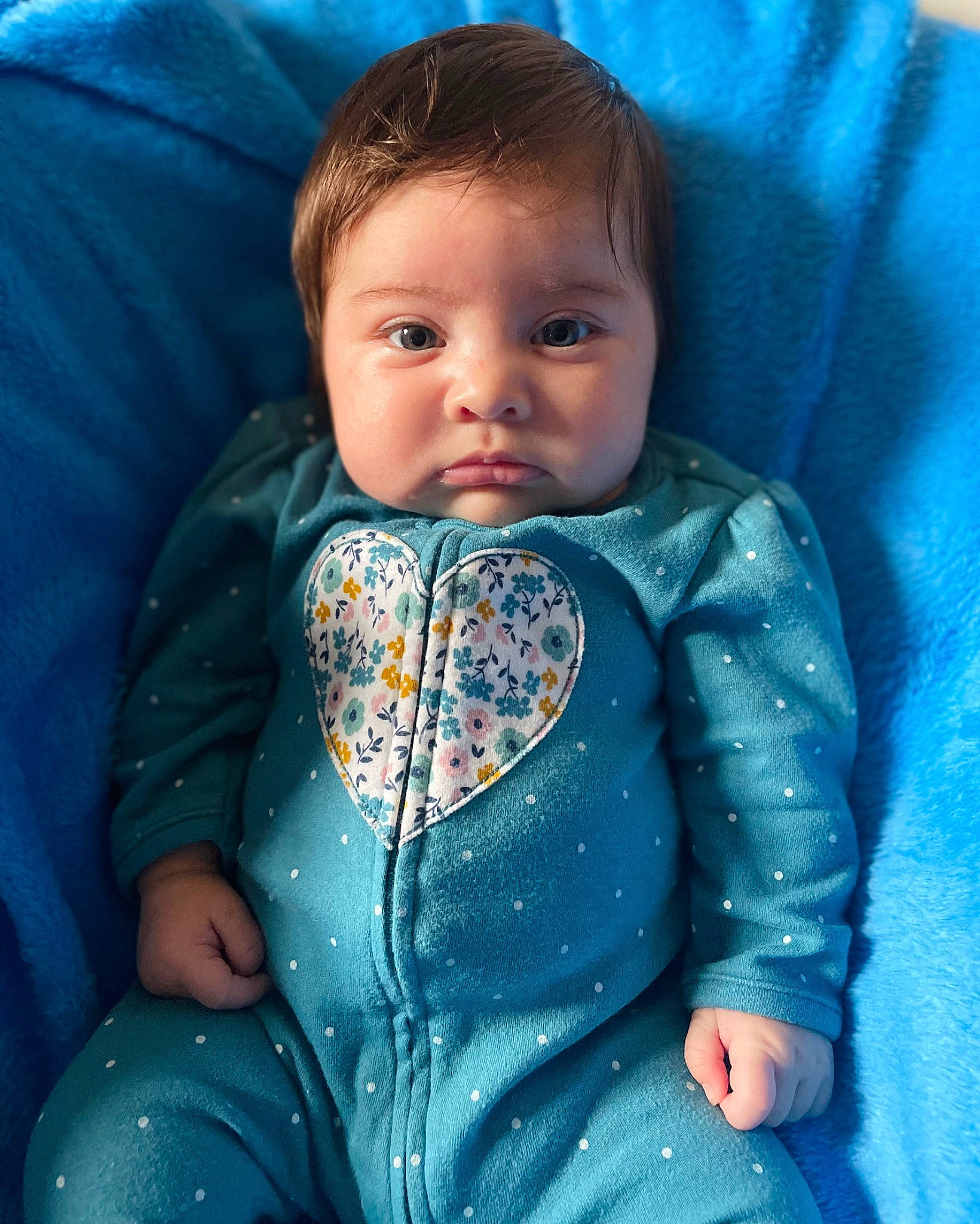 Zora is registered to the contest to win money with this photo: azure, baby_toddler_clothing, blue, cheek, comfort, cool, eye, eyebrow, facial_expression, head, iris, lip, mouth, neck, nose, outerwear, person, product, skin, sleeve