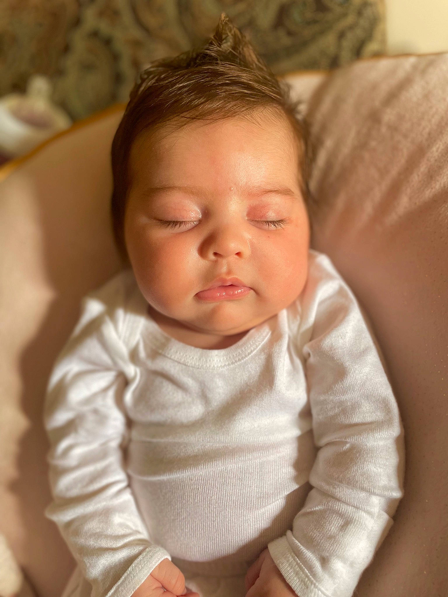 Zora is registered to the contest to win money with this photo: baby, baby_toddler_clothing, cheek, child, comfort, eyelash, finger, hand, happy, iris, linens, lip, mouth, neck, nose, person, sitting, skin, sleeve, thumb