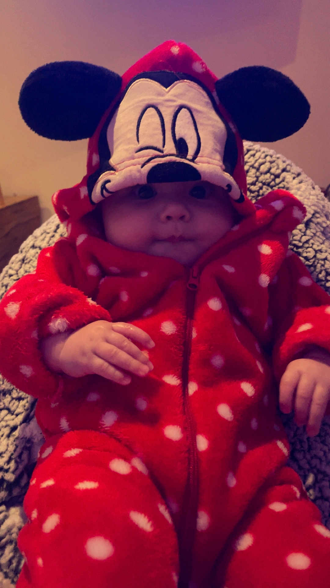 Nevaeh joined the competition — help win amazing prizes! baby, child, onesie, hood, polka_dot, red_clothing, cartoon_face, ears, blanket, cozy, cute, infant, hand, face, portrait, indoor, warm, soft, zipped, seated