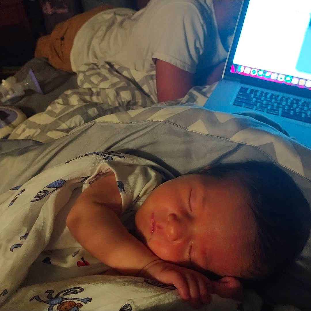 Destyn is registered to the contest to win money with this photo: baby, bed, bedding, bedtime, child, comfort, computer, gadget, input_device, laptop, linens, nap, netbook, output_device, person, personal_computer, room, sleep, space_bar, toddler