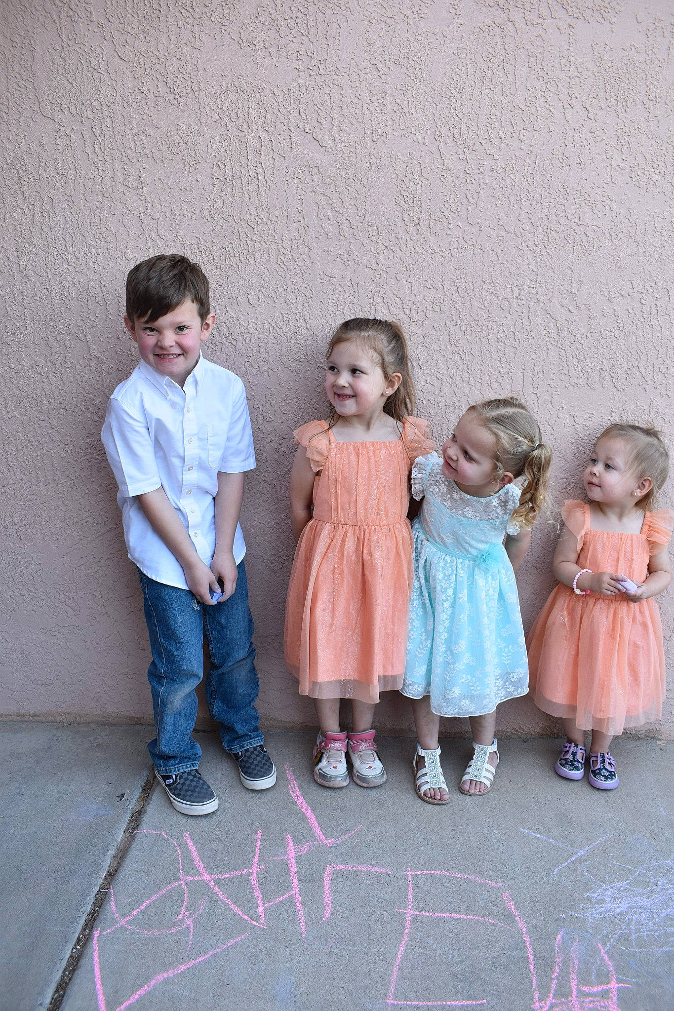 Levi is registered to the contest to win money with this photo: chalk, child, dress, event, face, fun, gesture, hair, happy, head, joy, leg, leisure, magenta, person, pink, sitting, skin, smile, standing