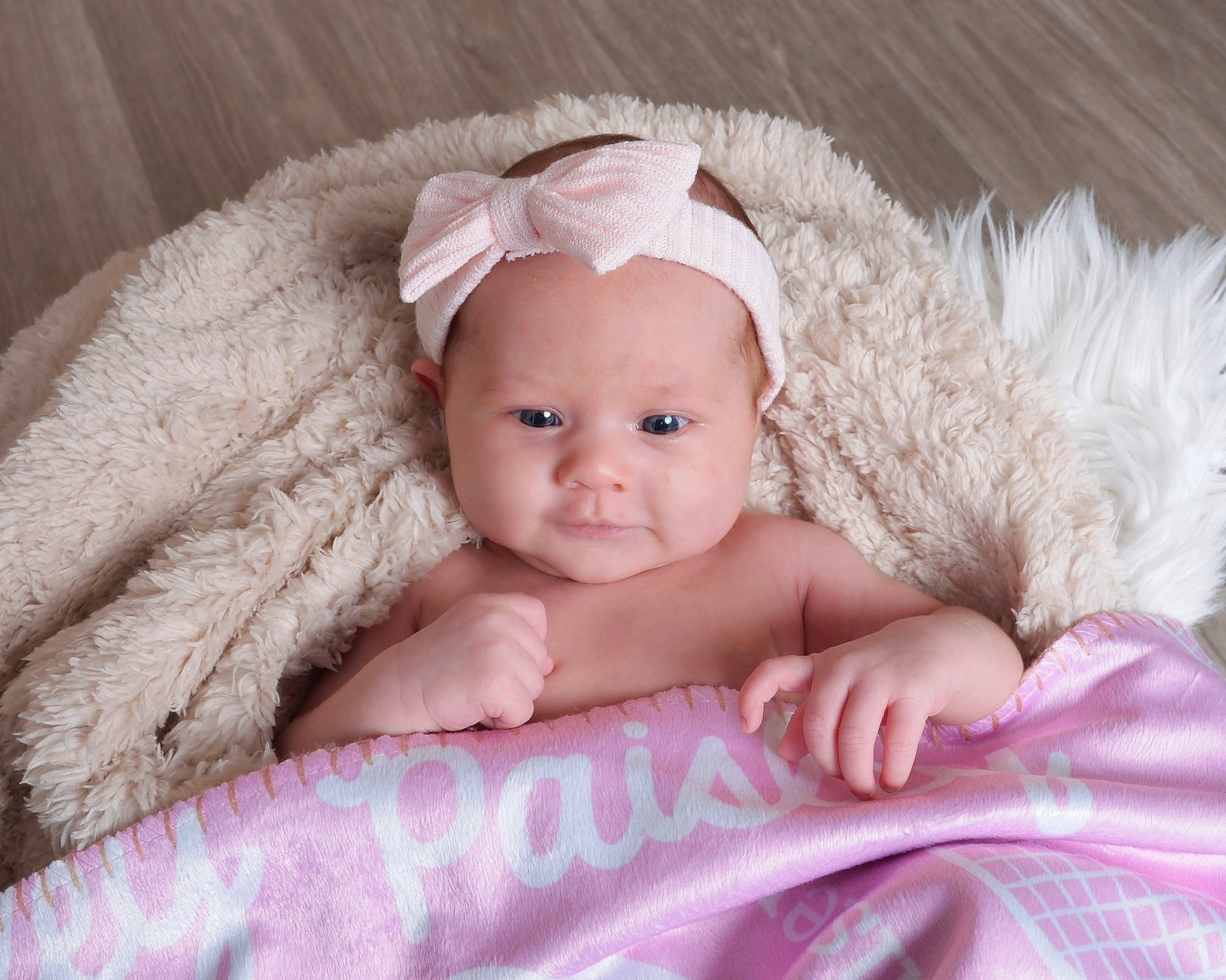 Paisley is registered to the contest to win money with this photo: baby, baby_toddler_clothing, cap, cheek, child, comfort, eye, fashion_accessory, fur, happy, hat, iris, linens, peach, person, pink, sitting, skin, sleeve, sun_hat