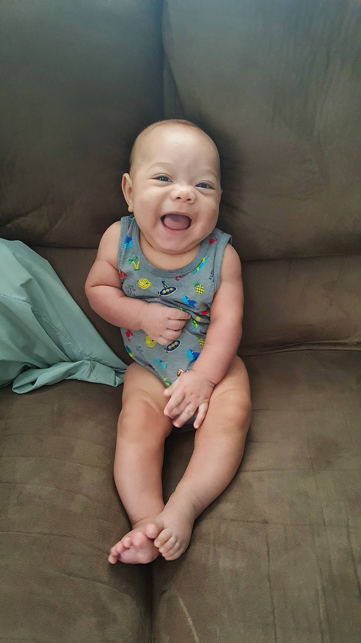 Markus is registered to the contest to win money with this photo: arm, baby, barefoot, cheek, child, face, finger, head, leg, person, sitting, skin, smile, toddler