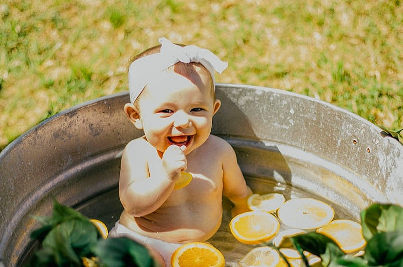 Blakely joined the competition — help win amazing prizes! baby, citrus, fruit, fun, grass, hand, happy, headwear, houseplant, joy, leaf, leisure, meyer_lemon, orange, people_in_nature, person, plant, rangpur, recreation, smile